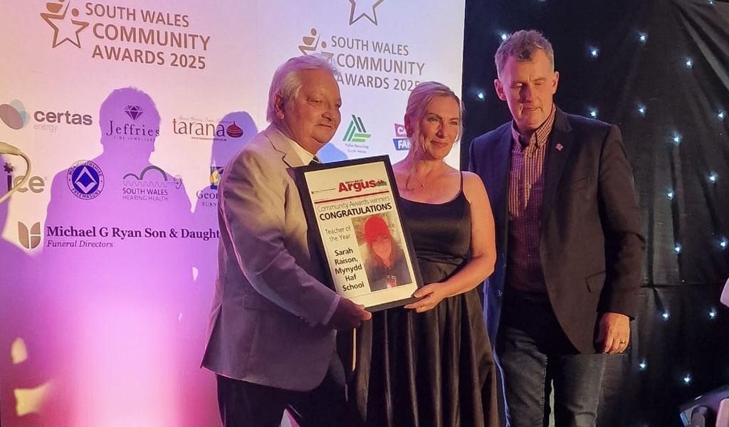 Michael George Ryan presenting the award for Teacher of the Year to winner Sarah Raison of Mynydd Haf School.